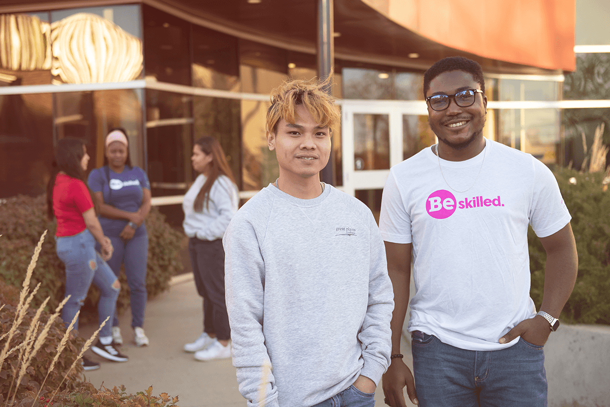 Two students wearing Great Plains College t-shirts and sweater