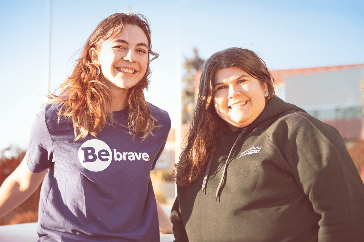 Two students wearing Great Plains College t-shirts and sweater