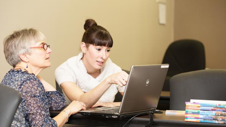 Instructor helping a student