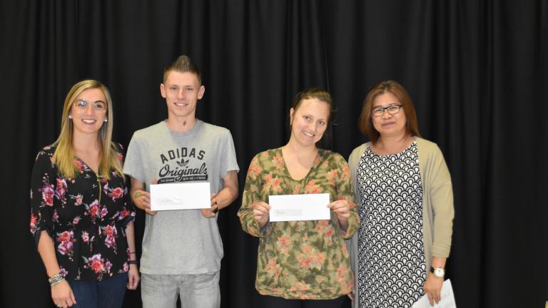 Newcomer Welcome Centre donor with student scholarship recipients