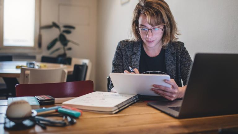 Person sitting at desk with computer